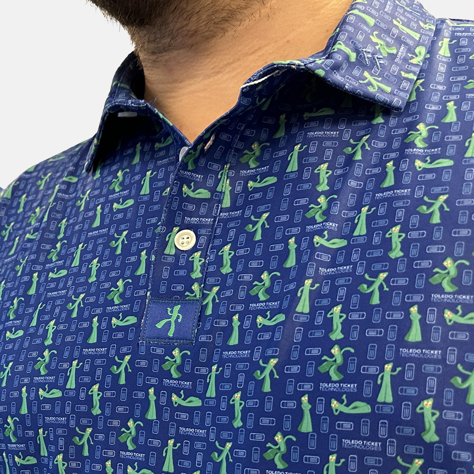 Close up of fabric detail of Gumby Toledo Tickets Men's polo clothing with custom fabric tag.