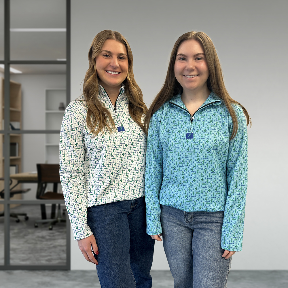 2 women wearing quarter zip Custom Gumby and Toledo Ticket pattern.