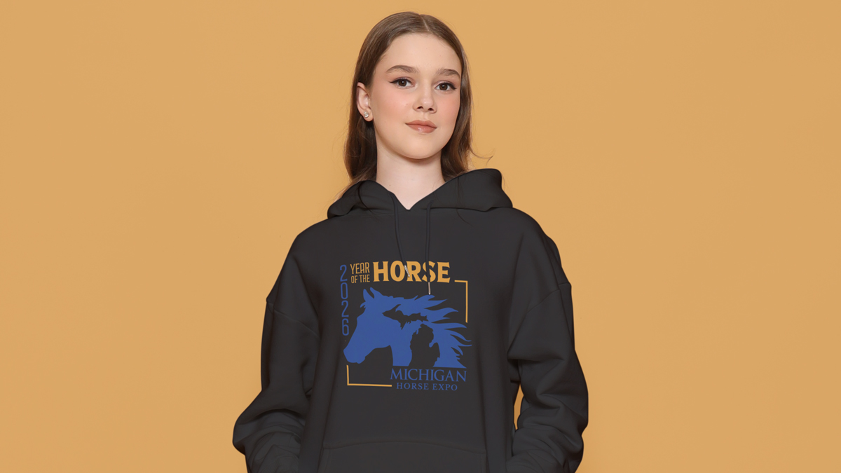 Young woman wearing black Michigan Horse Expo hoodie
