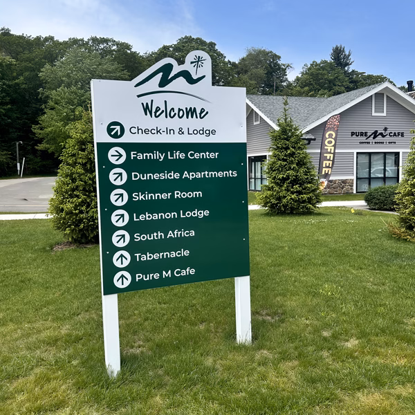 Outdoor directional sign outside of the Maranatha Cafe
